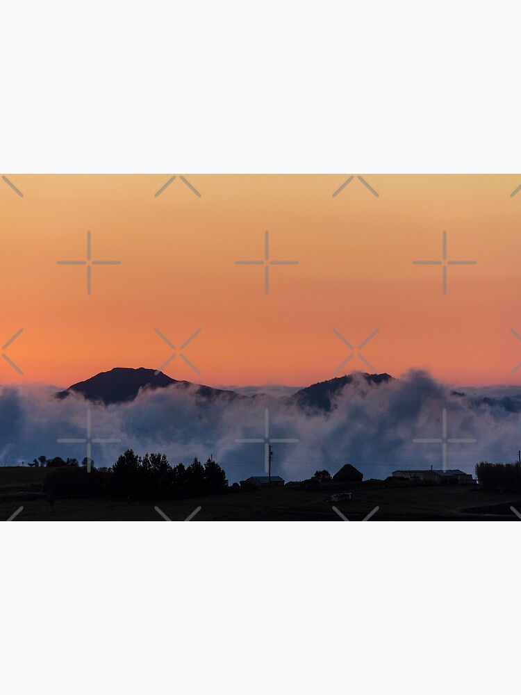 Orange sunset with mountain silhouette in clouds, Gulahuayco, Ecuador by kpander