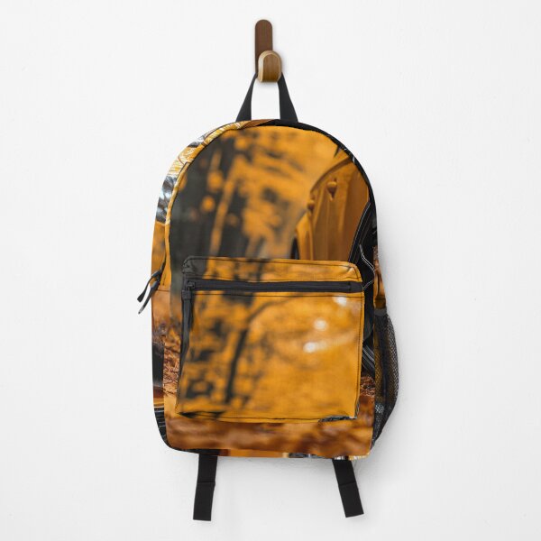 Item preview, A beautiful yellow sports car is parked on a leaf-covered road in a vibrant autumn forest, surrounded by orange and yellow foliage. designed and sold by Jerhus.