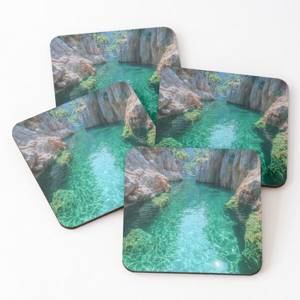 Item preview, Serene turquoise water flows through rocky cliffs into a secluded cove surrounded by lush vegetation and mountains under a bright sun. designed and sold by Jerhus.