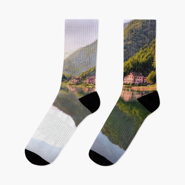 Item preview, Tranquil Lakeside Town with Mountain Reflections Art Print designed and sold by rajasekhark.