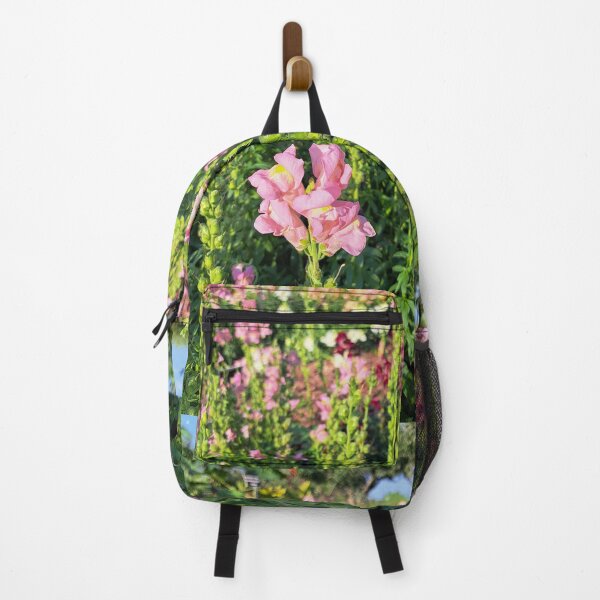 Item preview, Pink snapdragon flowers growning outside in golden hour sunset light outdoors in garden designed and sold by Jacobs-Media.
