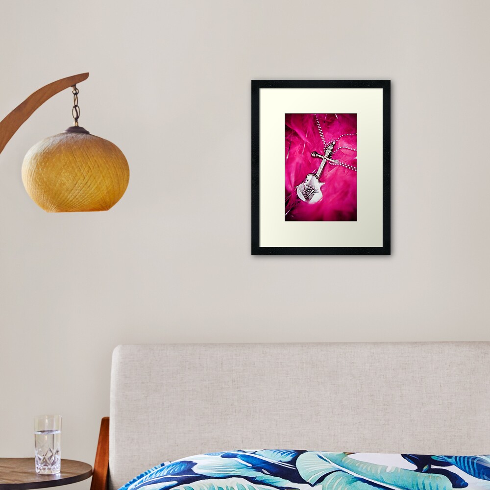 Guitar and pink feather Framed Art Print