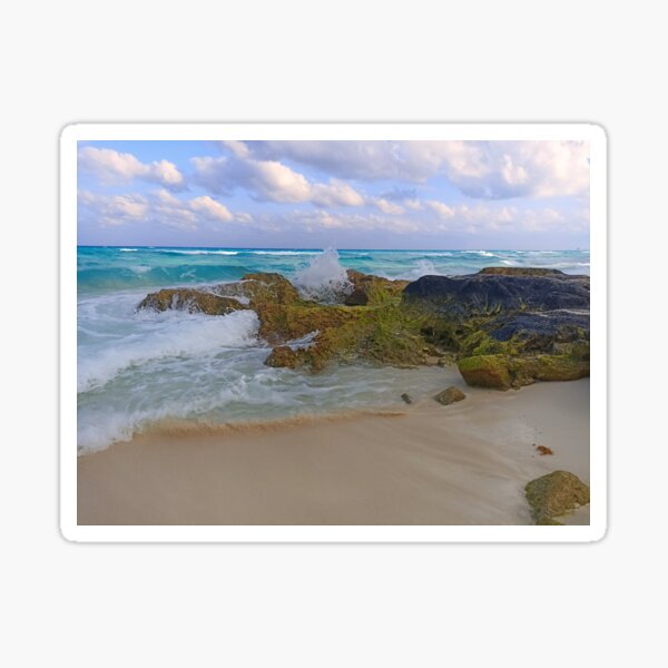 Sea waves crashing against the rocks on the beach Sticker