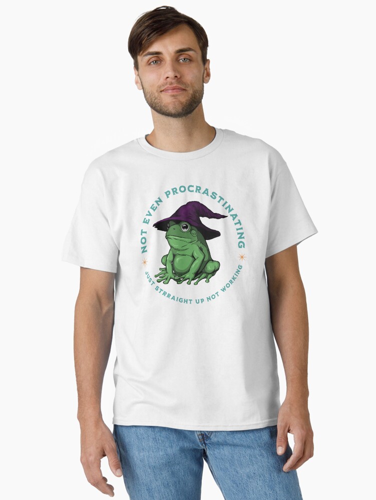 Thumbnail 1 of 7, Classic T-Shirt, Not Even Procrastinating Just Straight Up Not Working Frog Wizard designed and sold by leeleeandthebee.