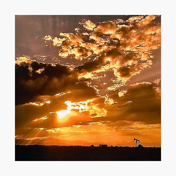 Item preview, Pump jack silhouetted against vibrant sunset cloud colors designed and sold by IFLYBaby.