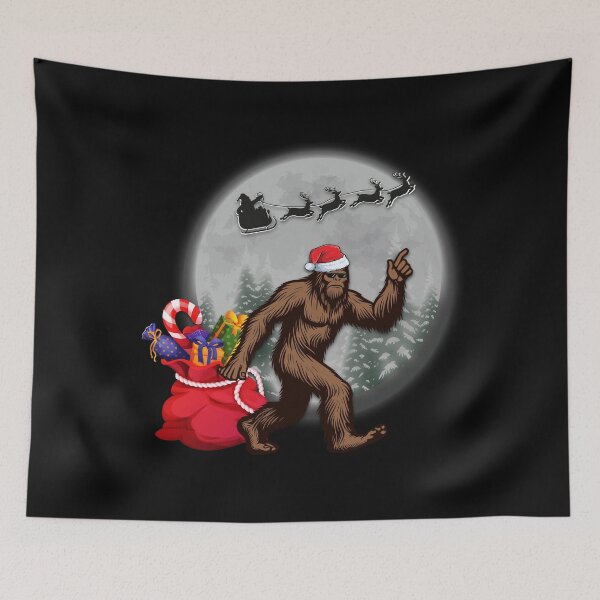 Item preview, Santa's Big Helper Bigfoot in a Santa Hat under the moonlight designed and sold by OhBoyLoveIt.