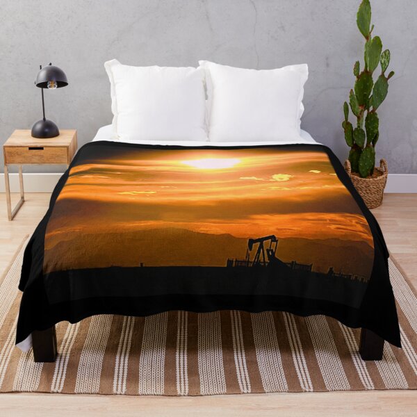 Item preview, Golden Clouds Embrace Sunlit Pump Jack at Dusk designed and sold by IFLYBaby.