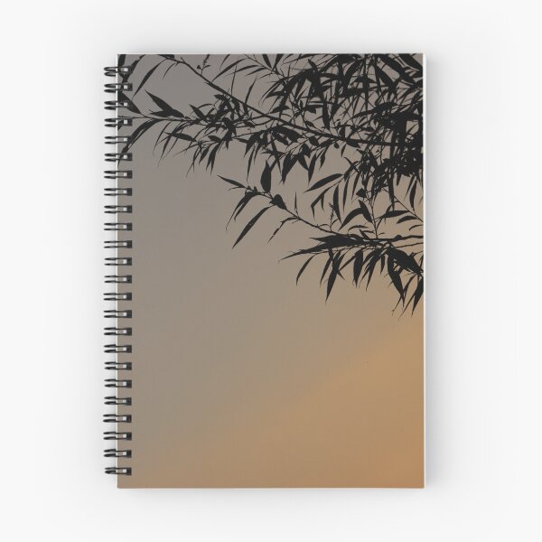 Item preview, bamboo leaves silhouetted against gradient blue grey to dark yellow sky  designed and sold by Jacobs-Media.