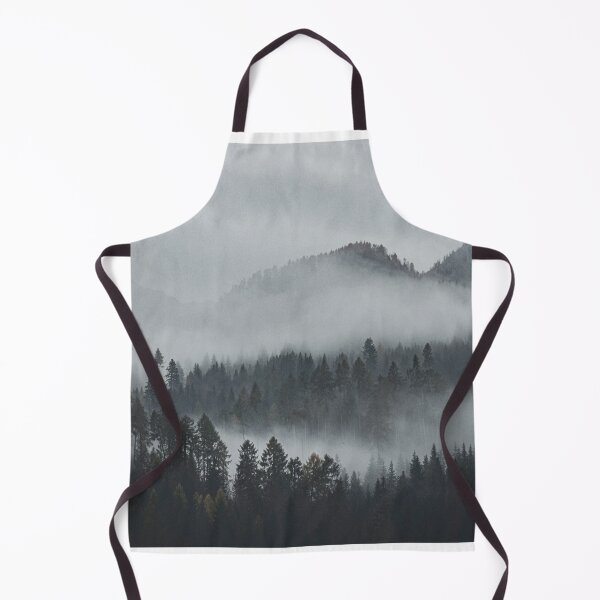 Item preview, A misty forest landscape with tall trees and mountain silhouettes in the background. designed and sold by Piotr Front.