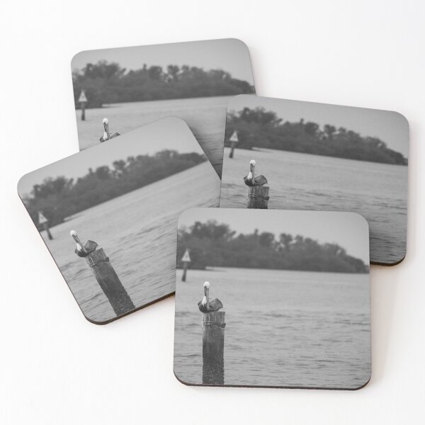 Item preview, A pelican perches calmly on a weathered post in a tranquil Gulf of Mexico at the Anclote Gulf Park. designed and sold by EyezWatchin.