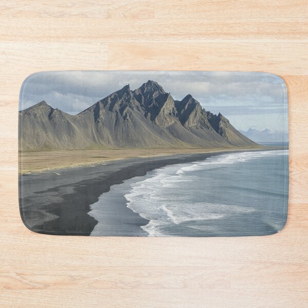 Item preview, Coastal view of Stokksnes mountain with black sand beach and waves on a clear day in Iceland. designed and sold by Jerhus.