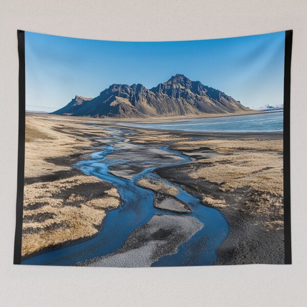Item preview, A serene river meanders through the golden landscape under a clear blue sky near a majestic mountain in Iceland during the day. designed and sold by Jerhus.