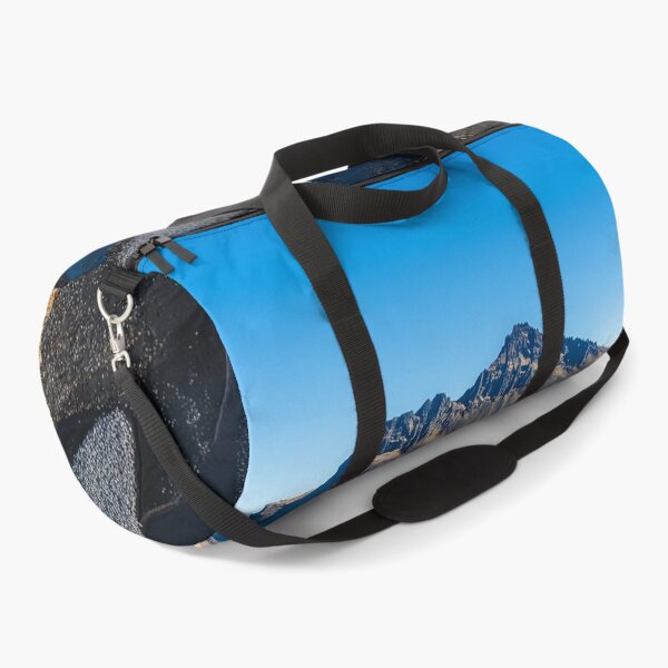 Item preview, A serene river meanders through the golden landscape under a clear blue sky near a majestic mountain in Iceland during the day. designed and sold by Jerhus.