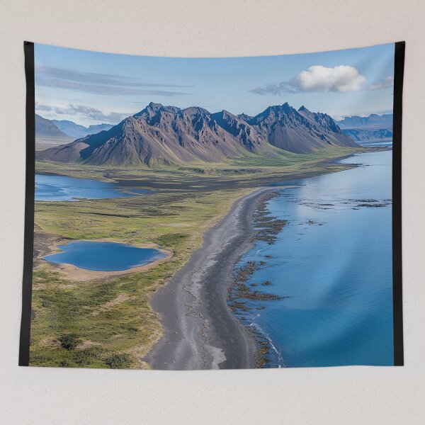 Item preview, Aerial view of a rugged coastline with mountains and calm waters on a sunny day in a remote wilderness area. designed and sold by Jerhus.