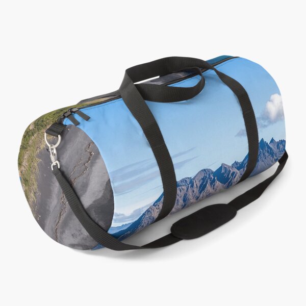 Item preview, Aerial view of a rugged coastline with mountains and calm waters on a sunny day in a remote wilderness area. designed and sold by Jerhus.