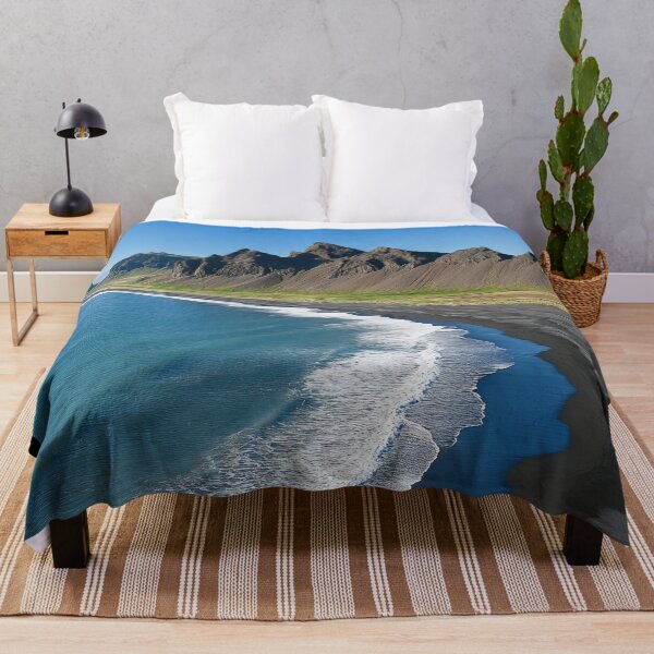 Item preview, Spectacular coastline with black sand beaches and dramatic mountains in Iceland under clear blue skies. designed and sold by Jerhus.