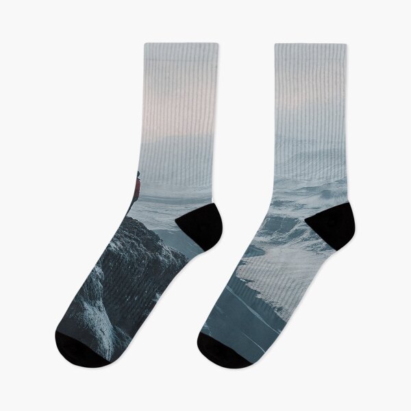 Item preview, A person stands on a snowy cliff overlooking a winding river in a remote and rugged landscape on a morning in Iceland. designed and sold by Jerhus.