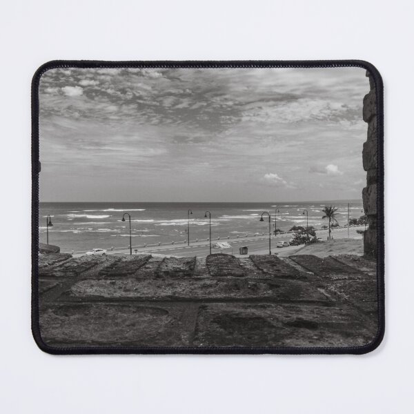 Item preview, Between two brick walls, a coastal scene unfolds with a view of the ocean under a cloudy sky designed and sold by EyezWatchin.
