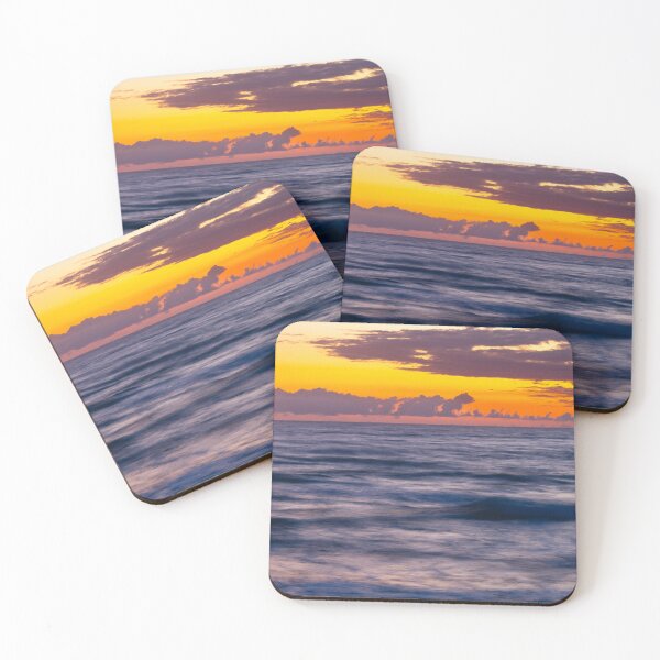 Item preview, Sunrise casts a warm glow over the ocean, blending orange and purple hues in the sky designed and sold by EyezWatchin.