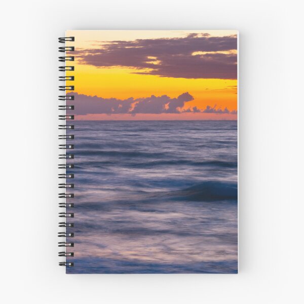 Item preview, Sunrise casts a warm glow over the ocean, blending orange and purple hues in the sky designed and sold by EyezWatchin.