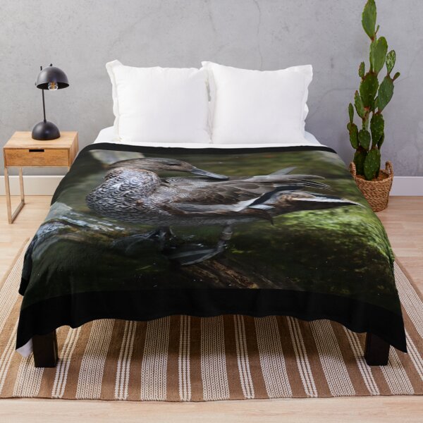 Item preview, Beautiful brown duck preening near water, standing on log. Duck with curved feathers and unique feather patterns designed and sold by Jacobs-Media.