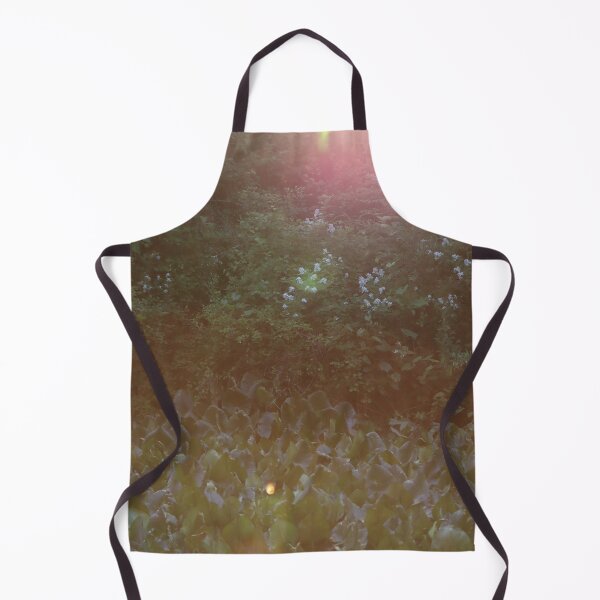 Item preview, Pink and yellow sunshine streaming down on lilypads with sunflairs against green trees designed and sold by Jacobs-Media.