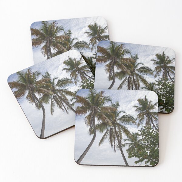 Item preview, A serene beach scene features a cluster of tall palm trees leaning designed and sold by EyezWatchin.