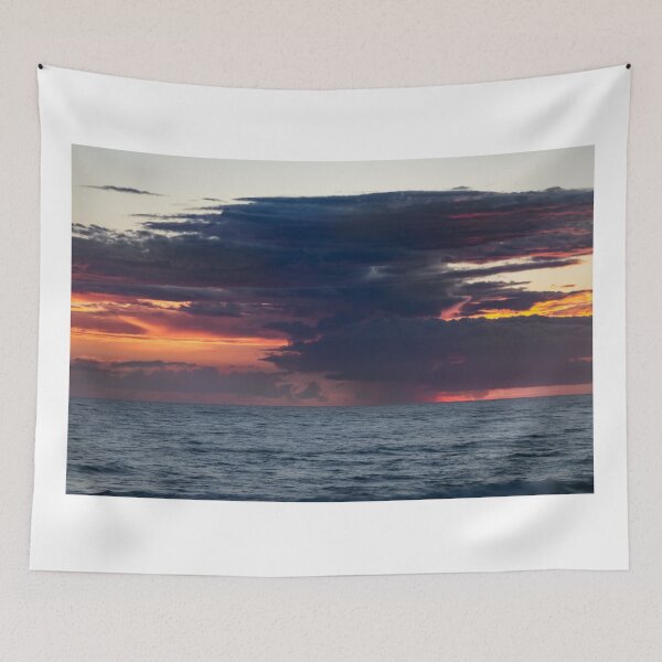 Item preview, Lightening strikes in a dramatic sunrise over the ocean, with dark, swirling clouds designed and sold by EyezWatchin.