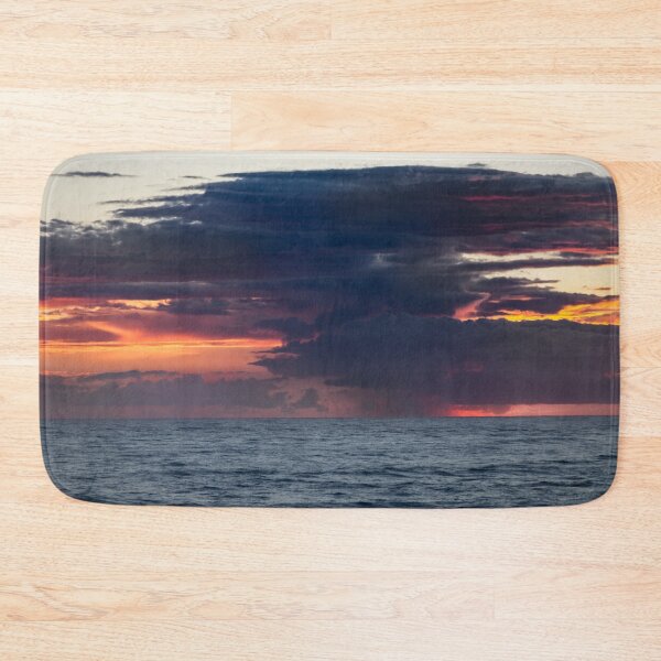 Item preview, Lightening strikes in a dramatic sunrise over the ocean, with dark, swirling clouds designed and sold by EyezWatchin.