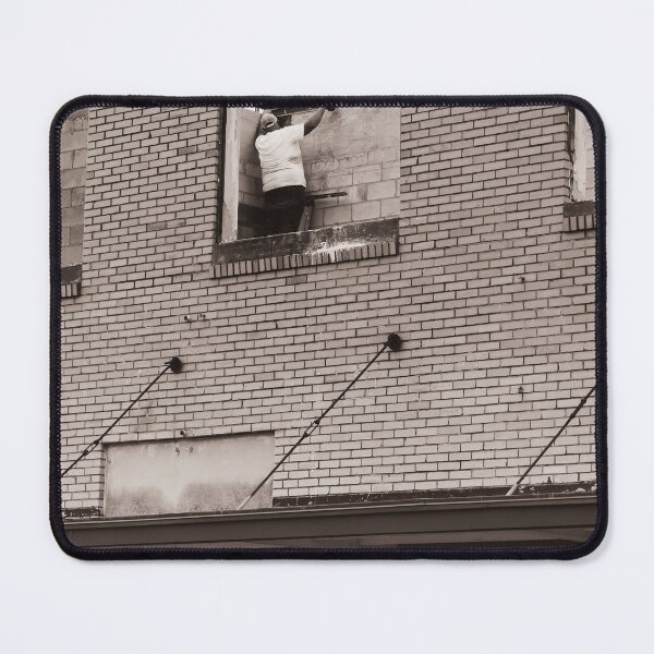 Item preview, A construction worker is working on a wall brick building viewed through an unfinished window designed and sold by EyezWatchin.