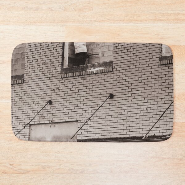 Item preview, A construction worker is working on a wall brick building viewed through an unfinished window designed and sold by EyezWatchin.