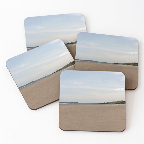 Item preview, Bamburgh beach coastline on a bright sunny day designed and sold by ast-photography.