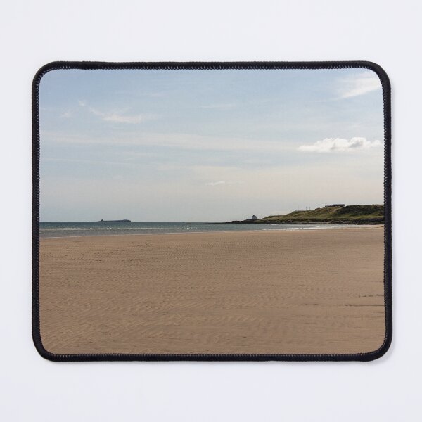 Item preview, Bamburgh beach coastline on a bright sunny day designed and sold by ast-photography.