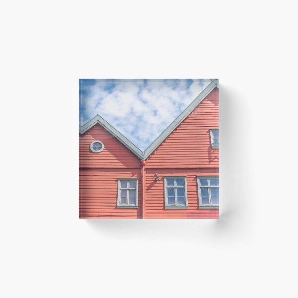 Item preview, Two world heritage houses in Bryggen in Bergen, Norway in red with a blue cloudy sky - summer street and travel photography designed and sold by Christa Stroo Photography.