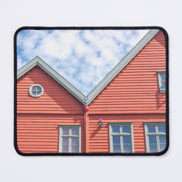 Item preview, Two world heritage houses in Bryggen in Bergen, Norway in red with a blue cloudy sky - summer street and travel photography designed and sold by Christa Stroo Photography.