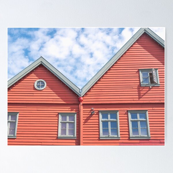 Item preview, Two world heritage houses in Bryggen in Bergen, Norway in red with a blue cloudy sky - summer street and travel photography designed and sold by Christa Stroo Photography.