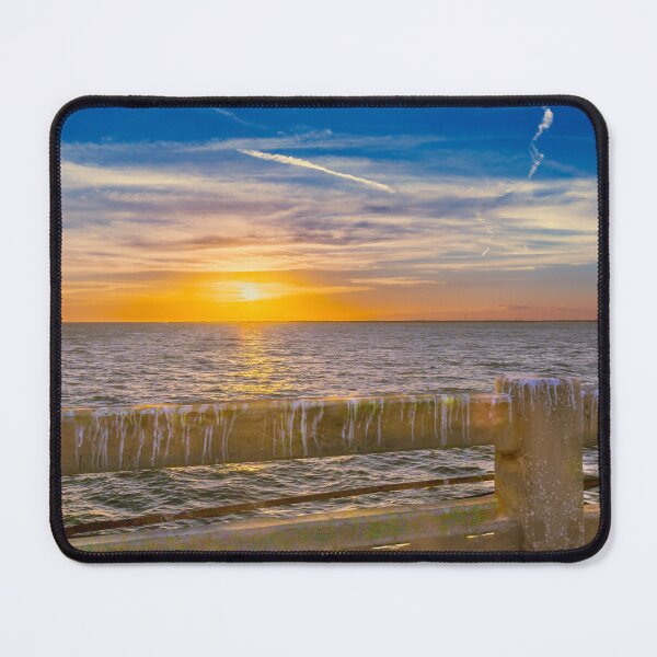 Item preview, A vibrant sunset paints the sky with warm hues of orange and yellow over a calm bay Sunshine Skyway Florida designed and sold by EyezWatchin.