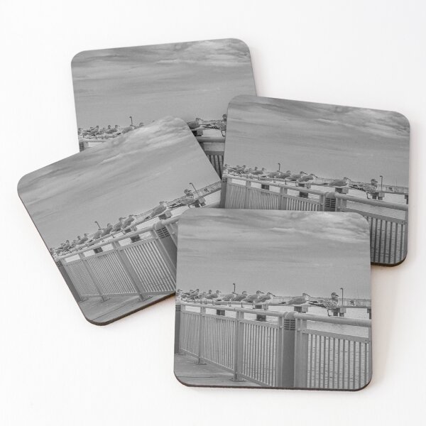 Item preview, Seagulls are perched along a metal railing by the waterfront, creating a serene coastal scene designed and sold by EyezWatchin.