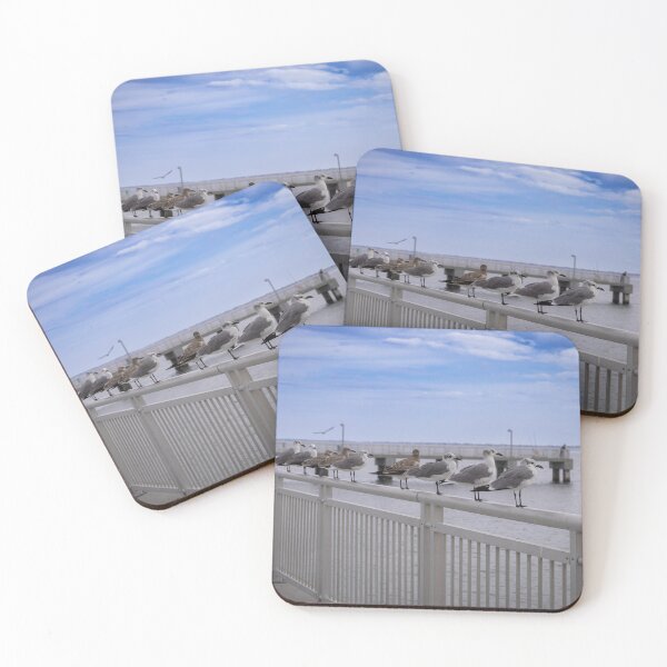 Item preview, A group of seagulls lines a metal railing by the waterfront, with a cloudy blue sky stretching over the distant horizon designed and sold by EyezWatchin.