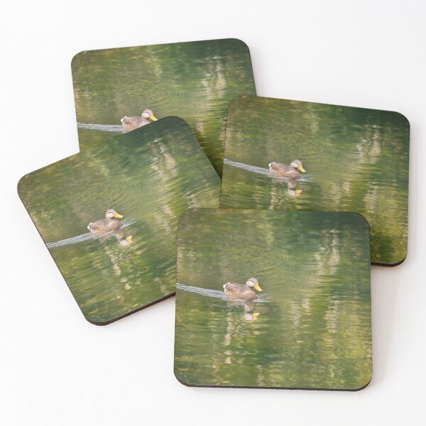 Item preview,  duck glides serenely across a calm body of water, creating gentle ripples in the water's reflective surface designed and sold by EyezWatchin.