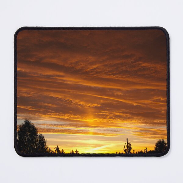 Item preview, Sunset behind trees with warm glowing clouds designed and sold by Piotrek0001.
