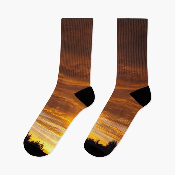 Item preview, Sunset behind trees with warm glowing clouds designed and sold by Piotrek0001.