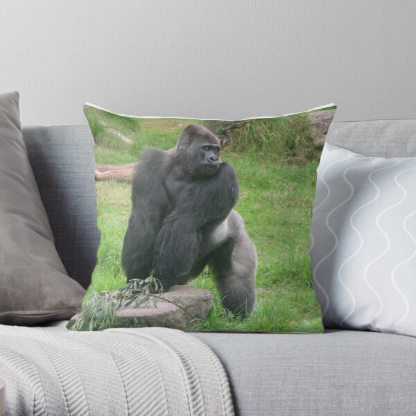 Gorilla male silverback great ape of Africa sitting in green jungle bushes  Throw Pillow