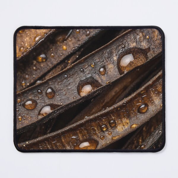 Item preview, Close-up of water droplets on dark brown leaves after rain capturing nature's intricacies in vibrant detail designed and sold by anytka.