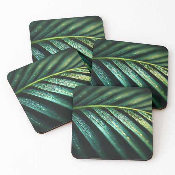 Item preview, Close-up of lush green palm leaf covered in droplets, captured in a vibrant tropical setting after rainfall designed and sold by anytka.