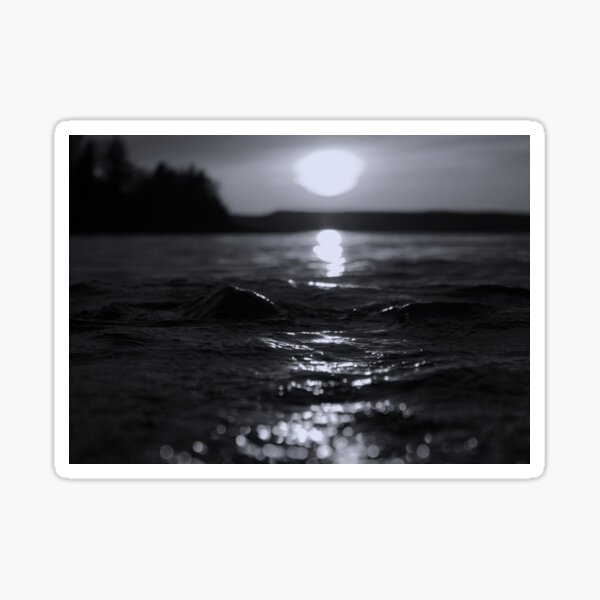 Light on the Water: Black and white phot of the sun setting on the water Sticker