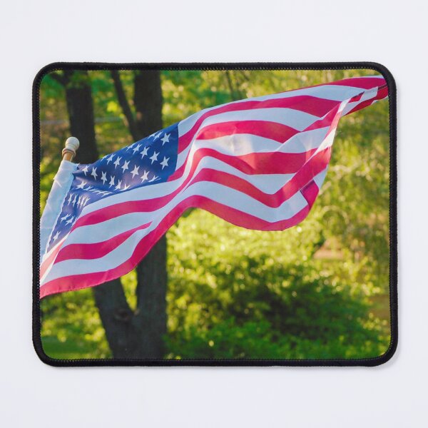 Item preview, American Flag Rippling in Front of Tree and Greenery  designed and sold by CountyKent.