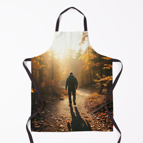 Item preview, A lone hiker walks along a winding path through a forest of vibrant autumn foliage, with golden and orange leaves illuminated by the sunlight designed and sold by homydesign.