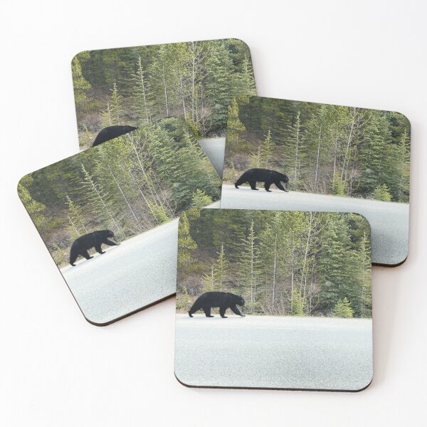 Item preview, Black bear walks alongside the road in Jasper National Park, Canada designed and sold by MostSplendid.