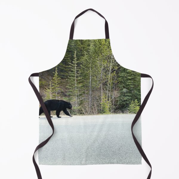 Item preview, Black bear walks alongside the road in Jasper National Park, Canada designed and sold by MostSplendid.